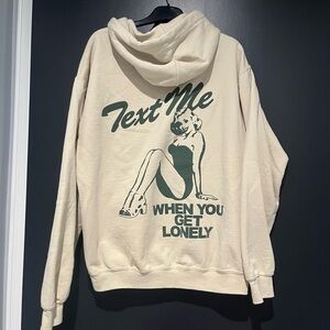 LONELY GHOST Cream Hoodie with Green Graphic text me when you get lonely